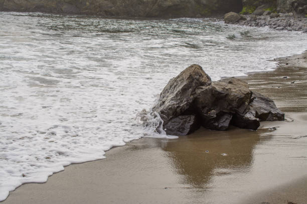istock Rocky coastline with foamy waves 1025795236