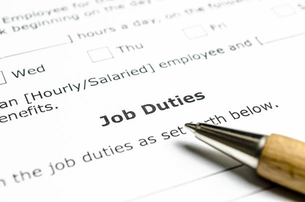 istock Job Duties contract with wooden pen 1025807092
