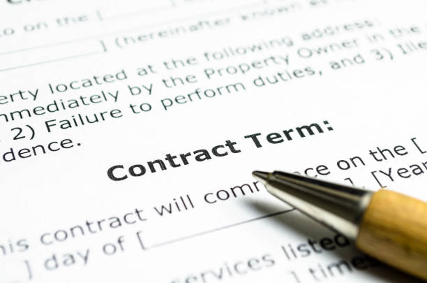 istock Contract term with wooden pen 1025807114