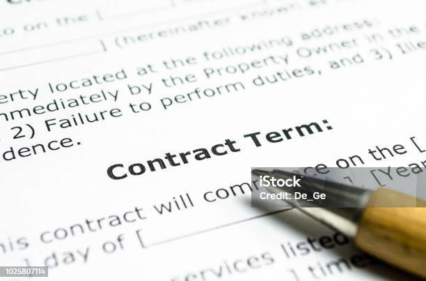 Contract Term With Wooden Pen Stock Photo - Download Image Now - Contract, Agreement, Text