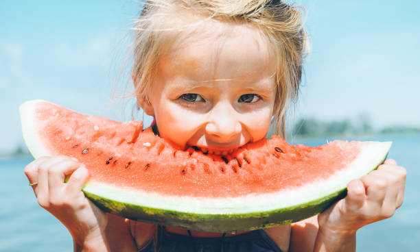 istock Little girl eat watermelon 1025814902