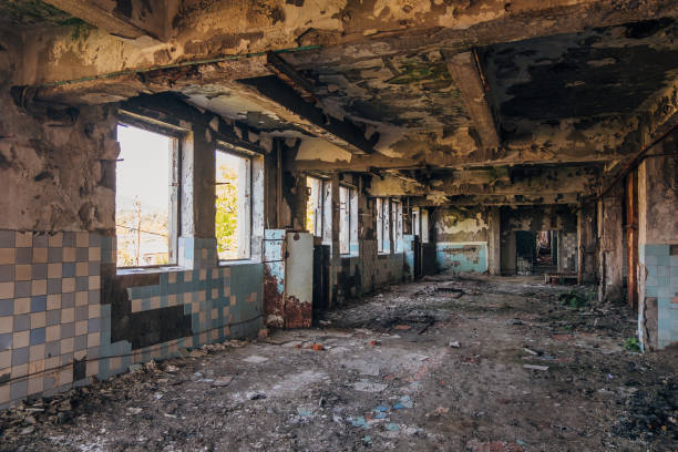 istock Dark interior of empty abandoned factory. 1025824288