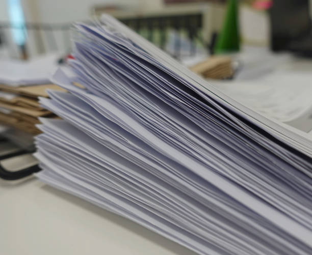 istock Pile of white paper report 1025833696