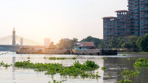 istock Boats carry the sand through the river. 1025833920