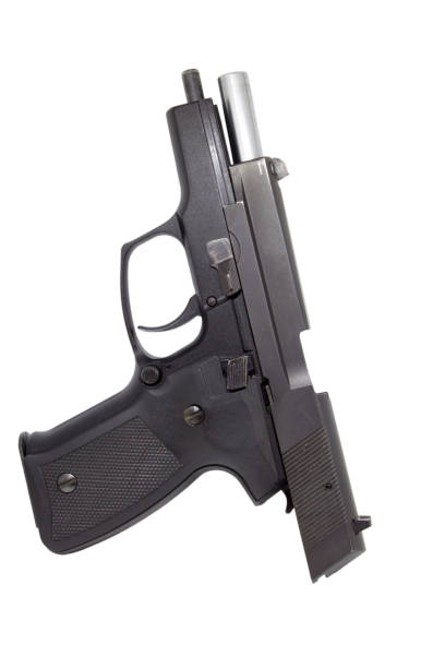 istock 9mm pistol isolated on white background 1025835482