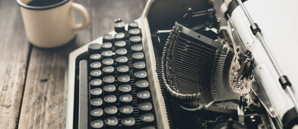 Author Workplace At Home Concept. Typewriter With Paper Sheet stock photo