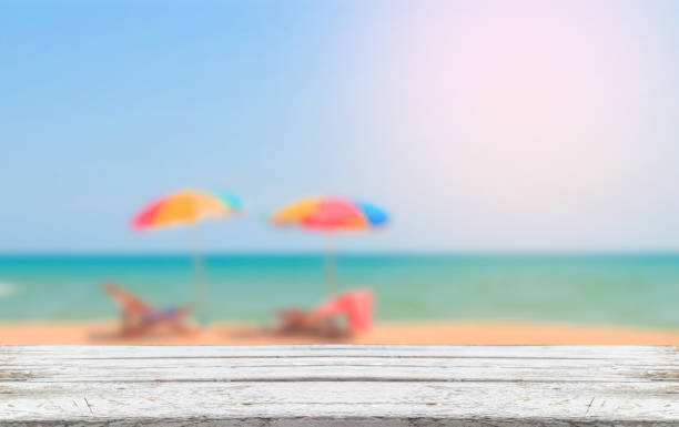 istock wooden plank with blurred beach background 1025852092