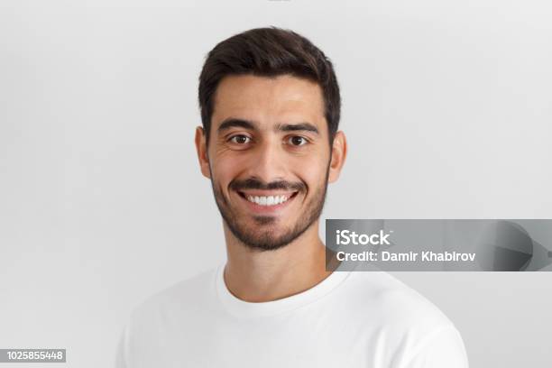 Stylish Bearded Man With Trendy Haircut Smiling To Camera Having Pleased Expression And Cheerful Look Positive Emotions Concept Stock Photo - Download Image Now