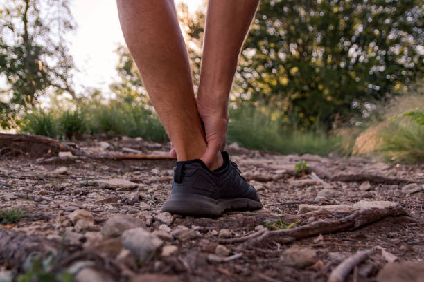 istock male ankle injury during jogging 1025855900