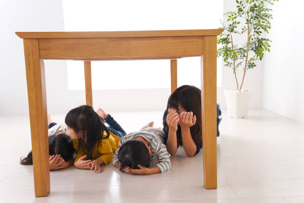istock Children taking refuge from earthquake 1025864260