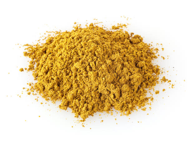 istock Heap of curry powder isolated on white background 1025868726