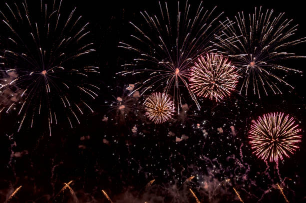 istock Red Fireworks on black background for cut out. For celebration design. Abstract holiday firework display background. 1025878640