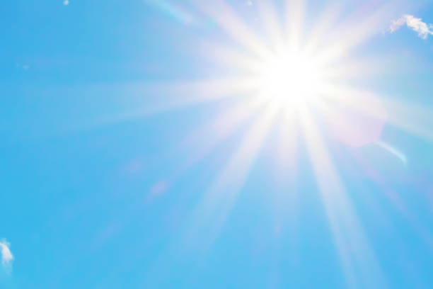 istock Sun with beautiful beams in the blue sky 1025885378