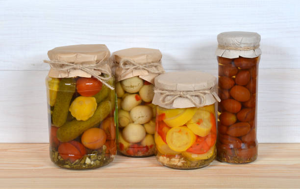 istock Glass Jars Of Preserved Vegetables 1025890894