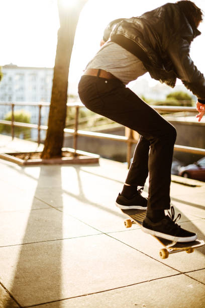 istock hipster skating in san francisco 1025895488