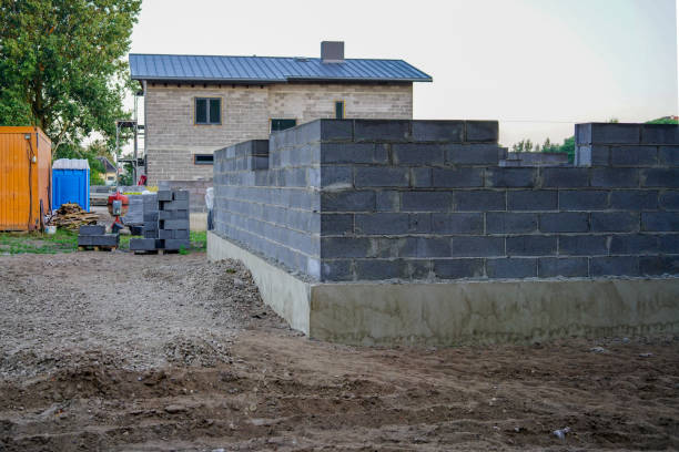 istock Concrete foundation of a new house, wall construction 1025895790