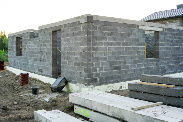 istock Concrete foundation of a new house, wall construction 1025895806