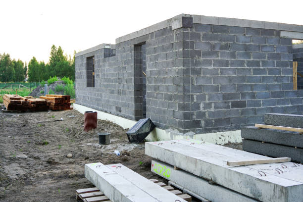 istock Concrete foundation of a new house, wall construction 1025895822