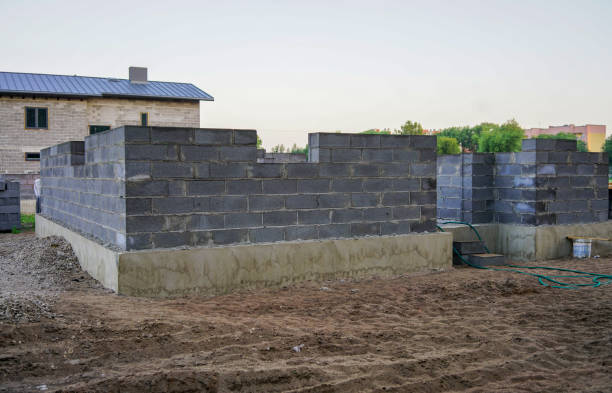 istock Concrete foundation of a new house, wall construction 1025895874