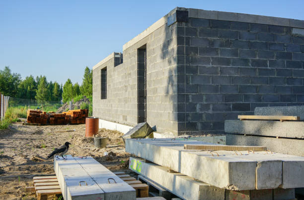istock Concrete foundation of a new house, wall construction 1025896100