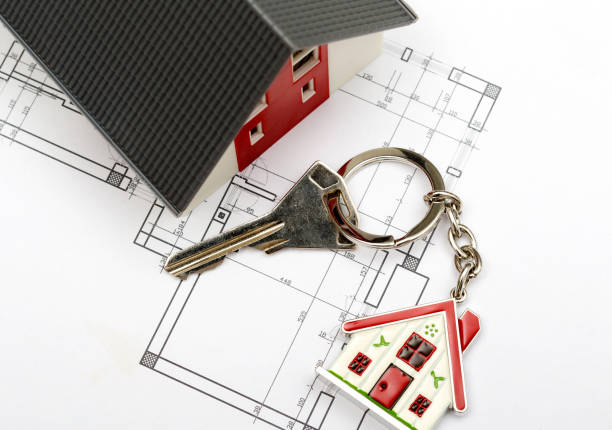 istock House project with blueprint and key 1025896116
