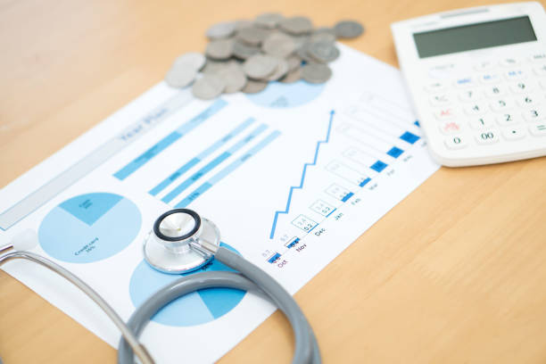 istock money coins with stethoscope checking 1025901682