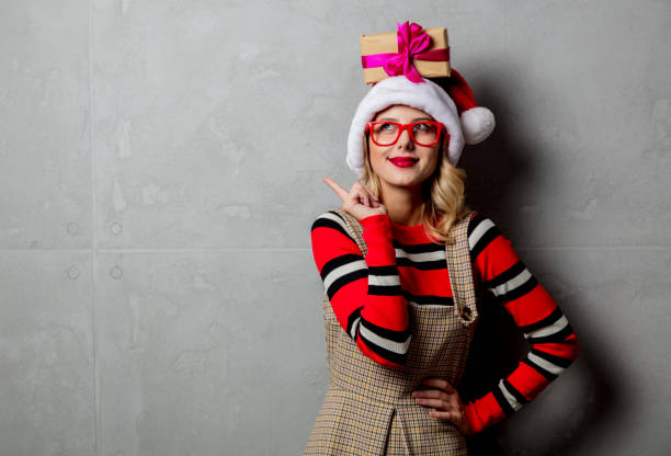 istock Young girl with Christmas gift box over head 1025903366