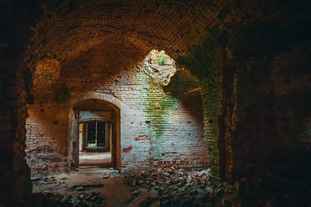 istock Ruined ancient brick temple inside interior with doors, corridors and arch 1025908196