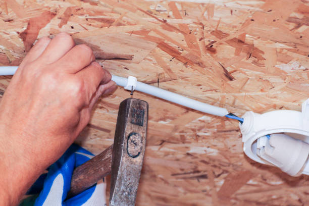 istock Fastening the cable with a plastic clip. 1025915584