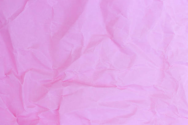 istock crumpled paper pink pastel colors, texture, background 1025922762