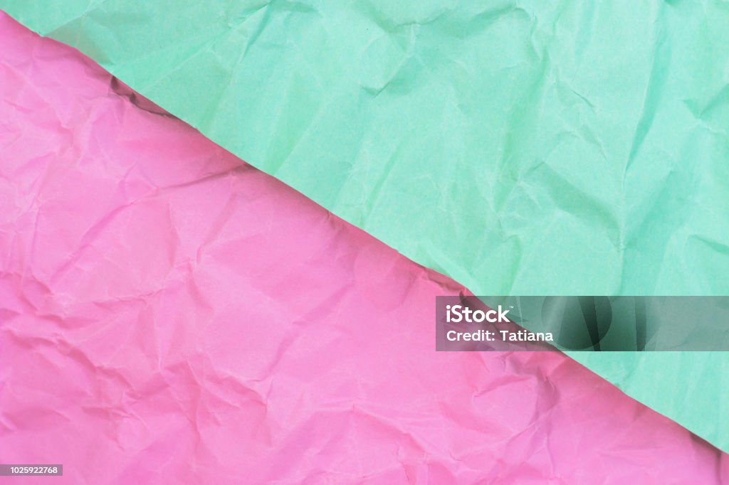 crumpled paper turquoise and pink pastel colors, texture, background Abstract Stock Photo