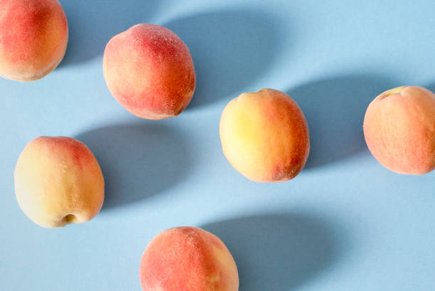 istock Whole ripe beautiful peaches with shadows 1025930414