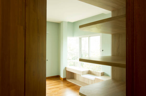 istock Half-open door of a light green room 1025933176