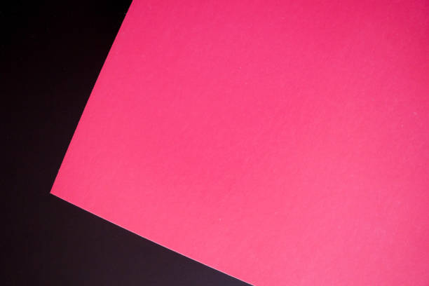 istock Dark flat lay background with color paper sheets. Black and pink. 1025933876