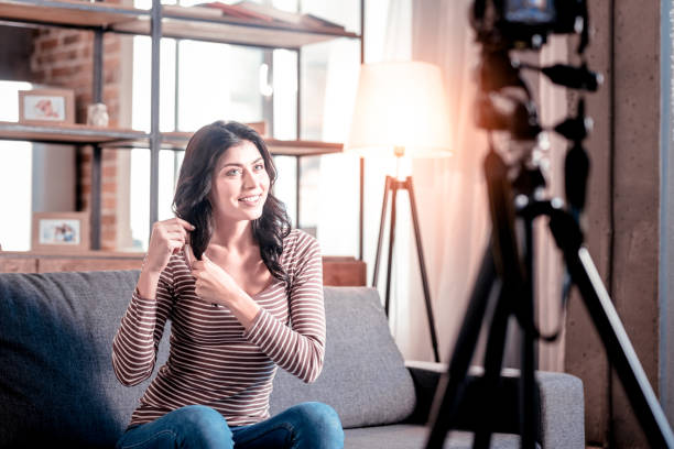 istock Cheerful blogger making a new video 1025934000