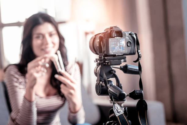 istock Delighted blogger making a video for her followers 1025937128