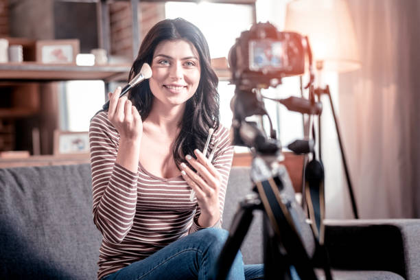 istock Joyful blogger making a video for her followers 1025937286