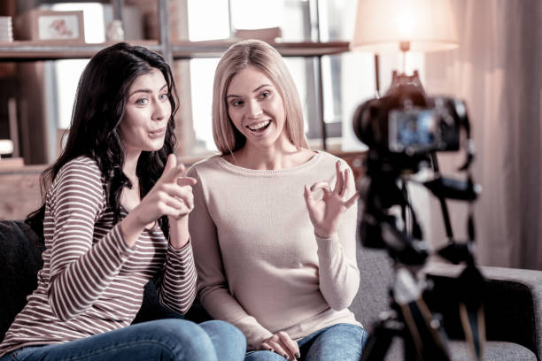 istock Delighted female bloggers recording a video 1025937700