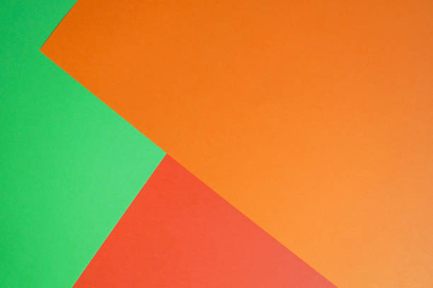 istock Unique background of bright paper sheets. Green, red and orange. 1025941704
