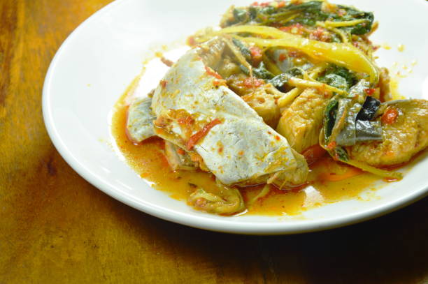istock spicy fried striped catfish with herb and curry 1025944758