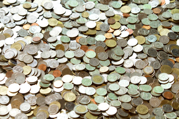 istock Pile of Thai coins background 1025945378
