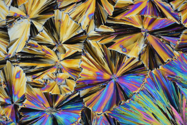 Photo through a microscope of crystals grown from the melt of sulfo-salicylic acid. stock photo