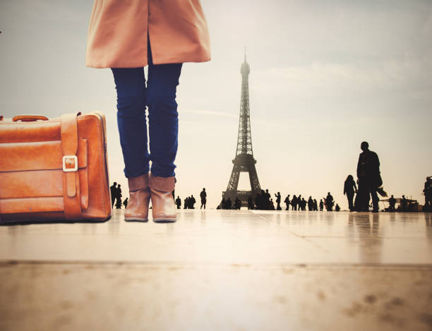 istock girl with suitcase in Paris 1025954416