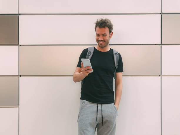istock Happy man with mobile phone 1025954742