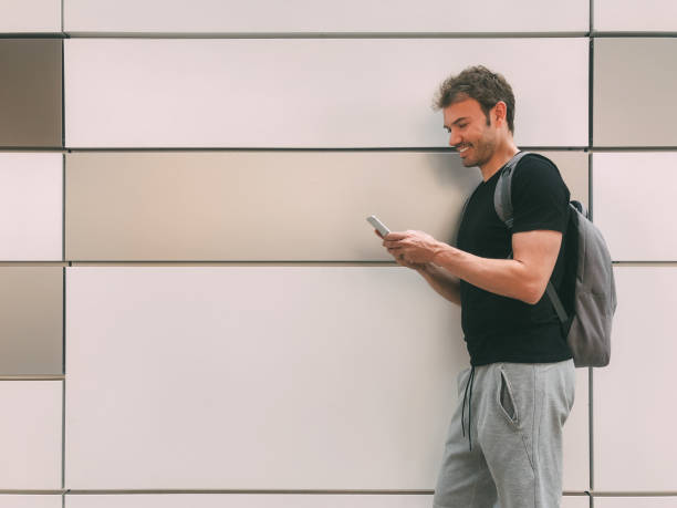 istock Happy man with mobile phone 1025954764