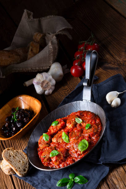 istock Rustic mini meatballs Baked in tomato sauce with basil 1025959426