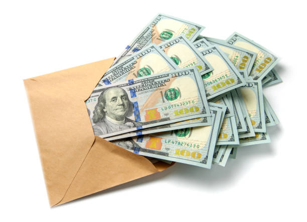 istock Envelope with money isolated on white background. The concept of a bribe, corruption, illegal wages, bonus, gift 1025959802