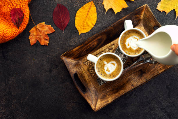 istock Top view of coffee cups around yellow leaves 1025959984