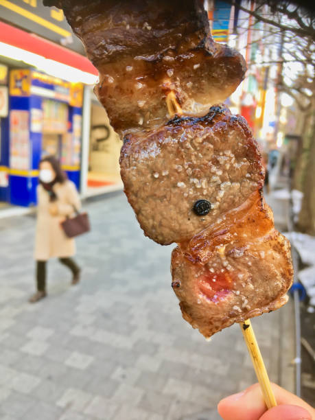 istock Kobe Japanese premium beef charcoal grilled skewer on hand 1025967636