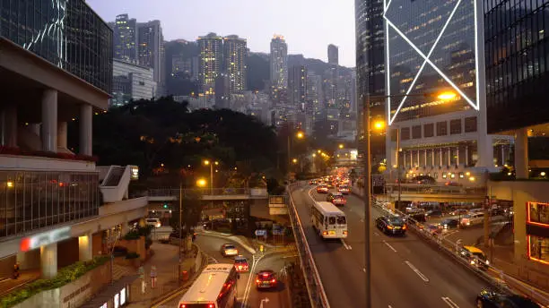 Photo of Busy Street Traffic With Night Skyline Of Central Hong Kong In Background
